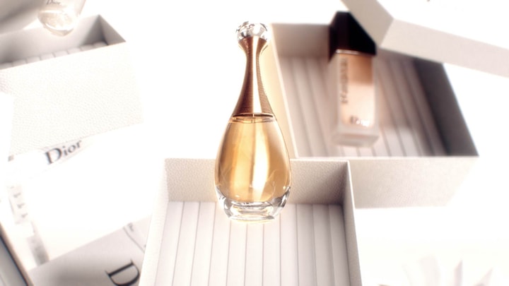 3D render of J'Adore Dior fragrance bottle in a motion design animation