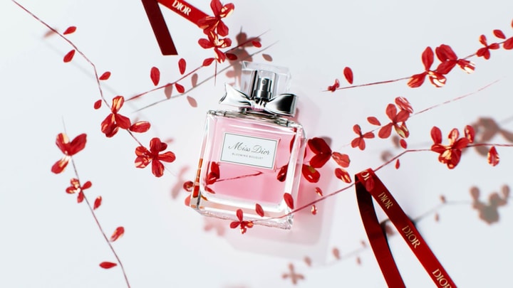 Chinese New Year 3D visual for Miss Dior with red flowers and ribbons