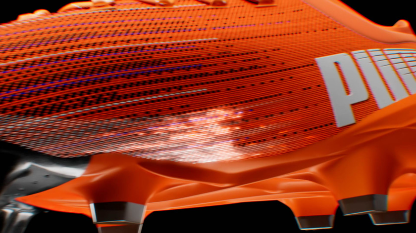 Motion Design animation of luminescent particles flowing around a soccer shoe