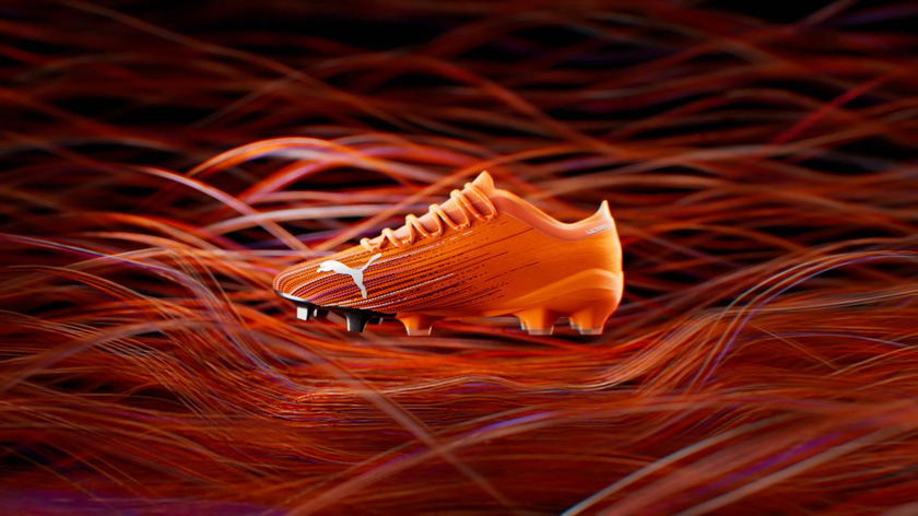 3D Puma Ultra soccer shoe with abstract wires in the background